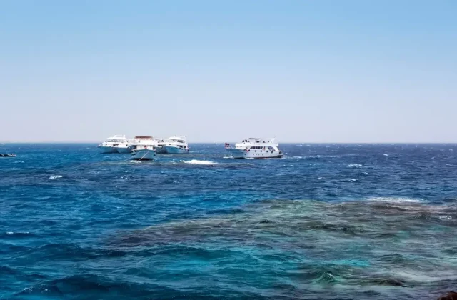 Boats anchored in turquoise water